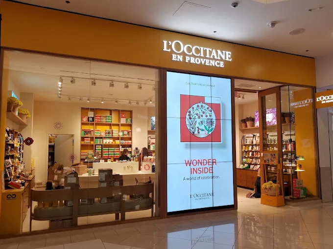 L'Occitane en Provence mall storefront with a portrait digital display installed by CrownTV.
